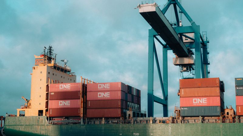 Container ship at port during cargo loading operations