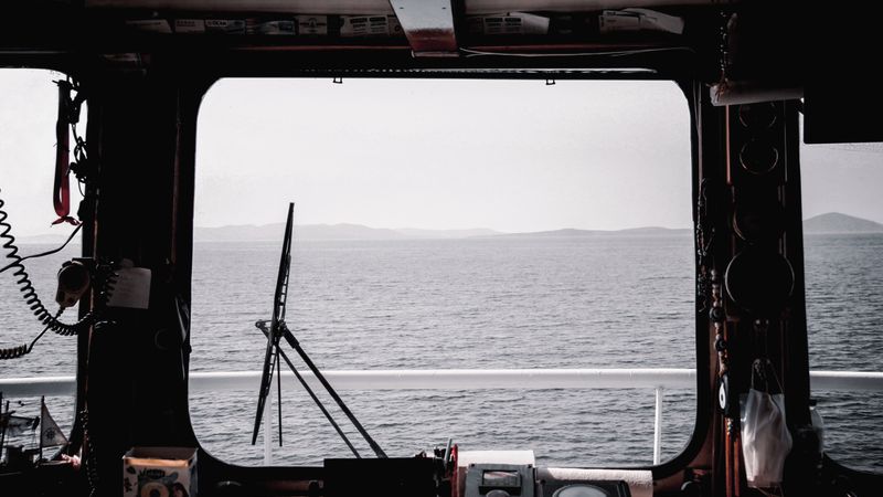 Ship bridge view over open water during voyage